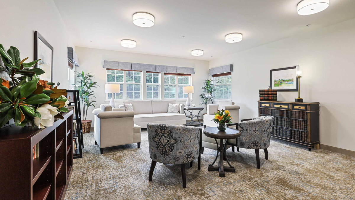 The library at Southern Pines with shelves of books and comfortable seating